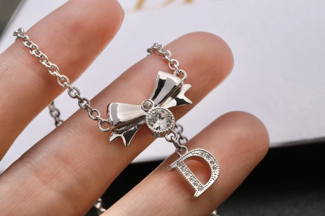 Vintage Bow and Crystal Logo Pendant Necklace D13516765 — view 4