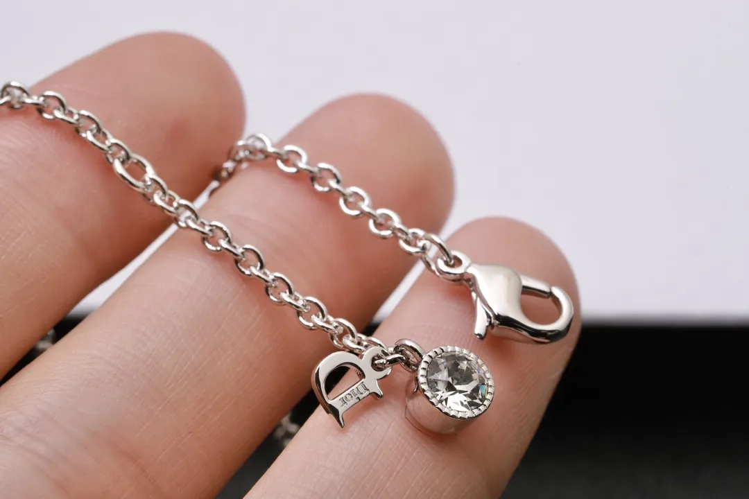 Vintage Bow and Crystal Logo Pendant Necklace D13516765 — view 6