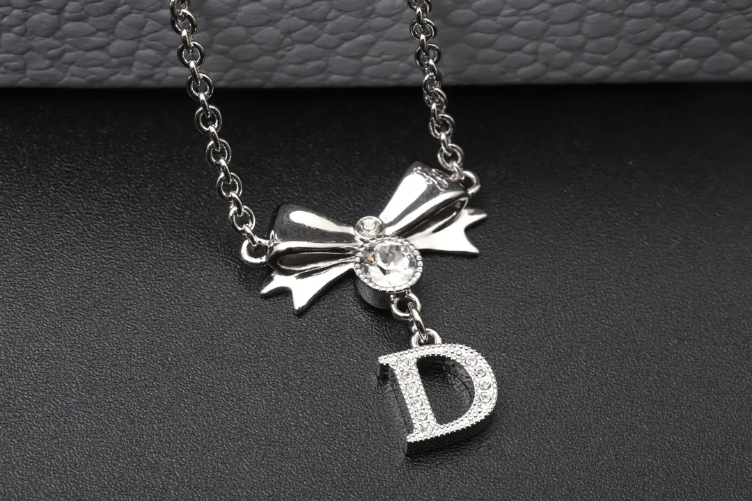Vintage Bow and Crystal Logo Pendant Necklace D13516765 — view 7