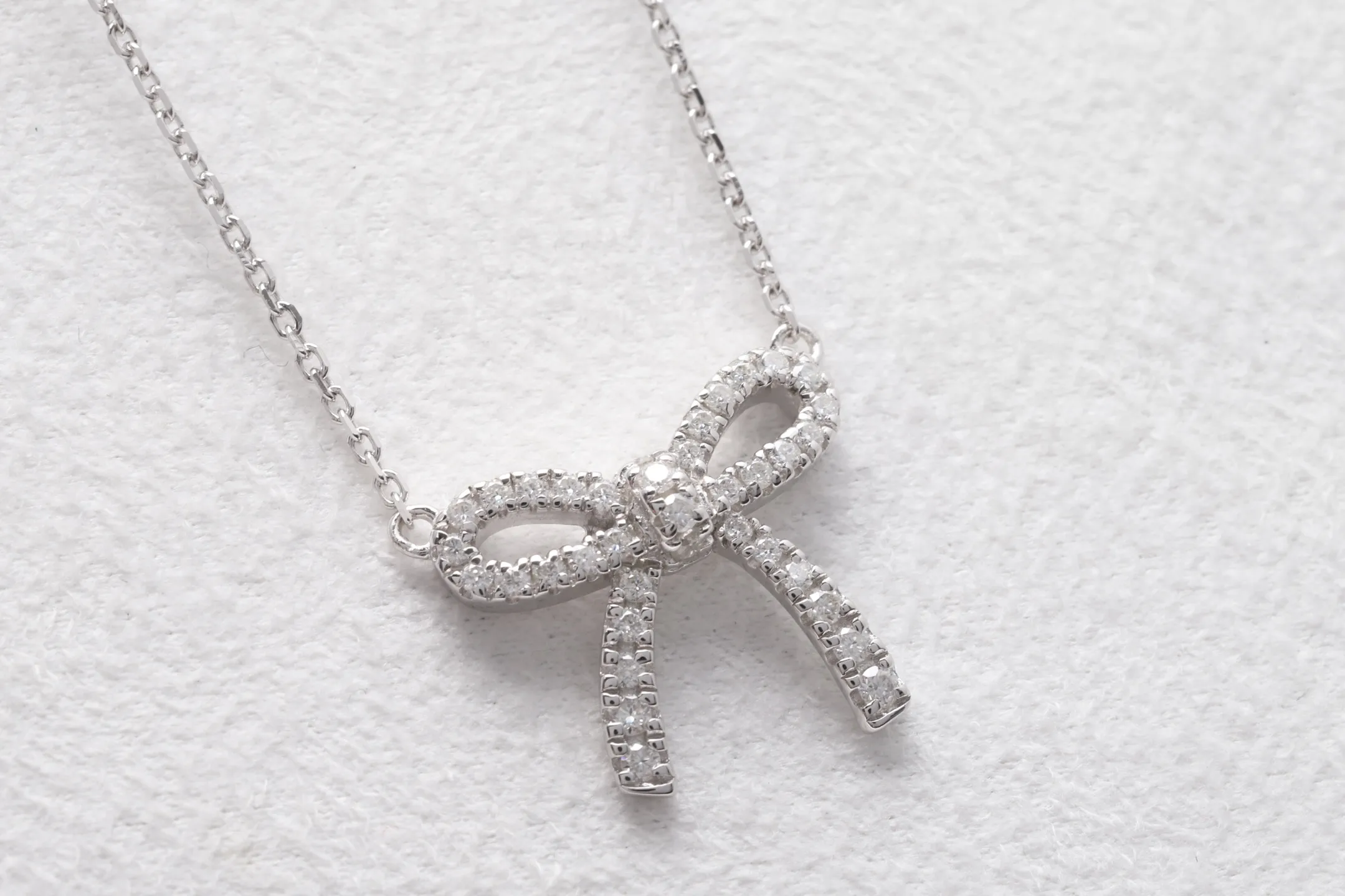 Moissanite Bow Pendant Necklace (Sterling Silver) D21516917 — view 7