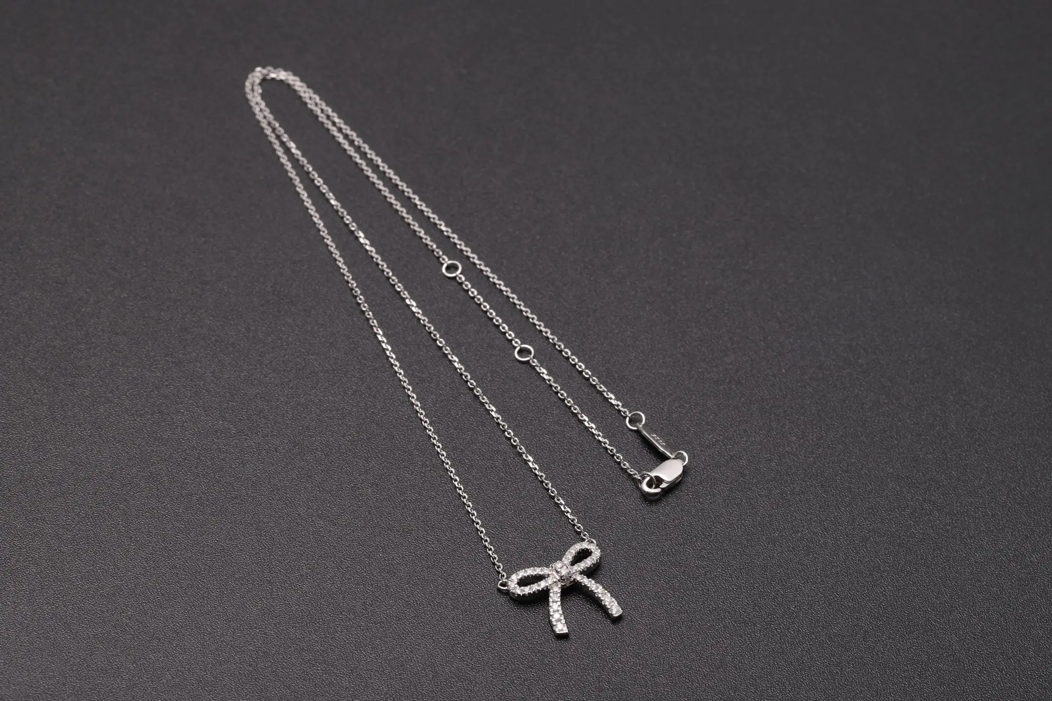 Moissanite Bow Pendant Necklace (Sterling Silver) D21516917 — view 8