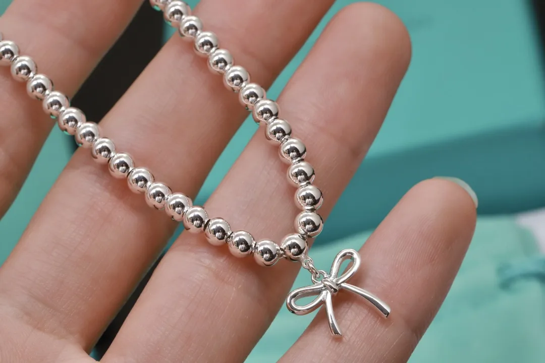 Beaded Bow Charm Bracelet (Sterling Silver) D29517005 — view 4