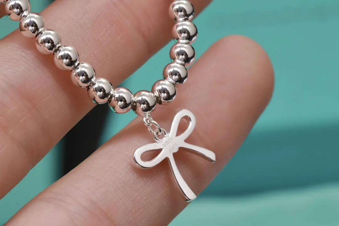 Beaded Bow Charm Bracelet (Sterling Silver) D29517005 — view 5