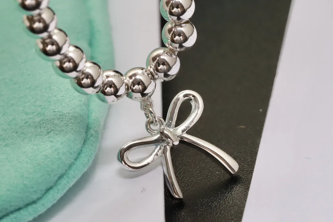 Beaded Bow Charm Bracelet (Sterling Silver) D29517005 — view 7