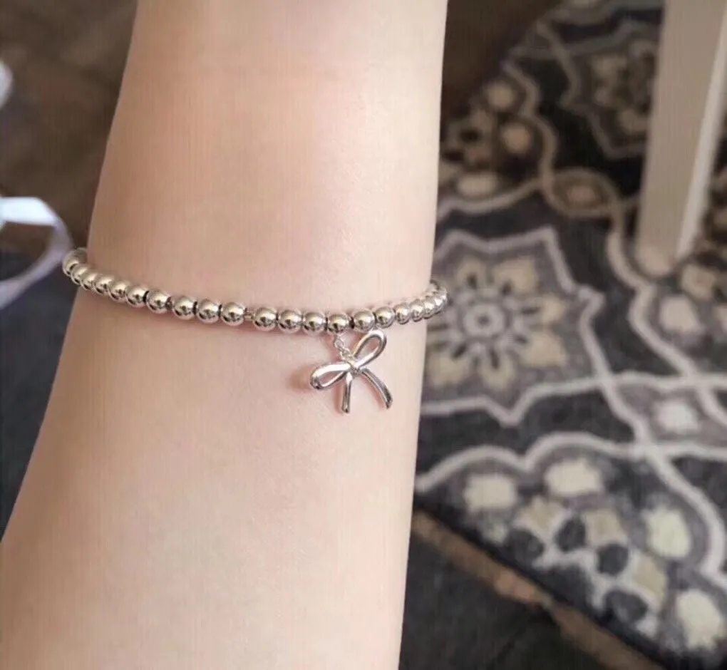 Beaded Bow Charm Bracelet (Sterling Silver) D29517005 — view 9