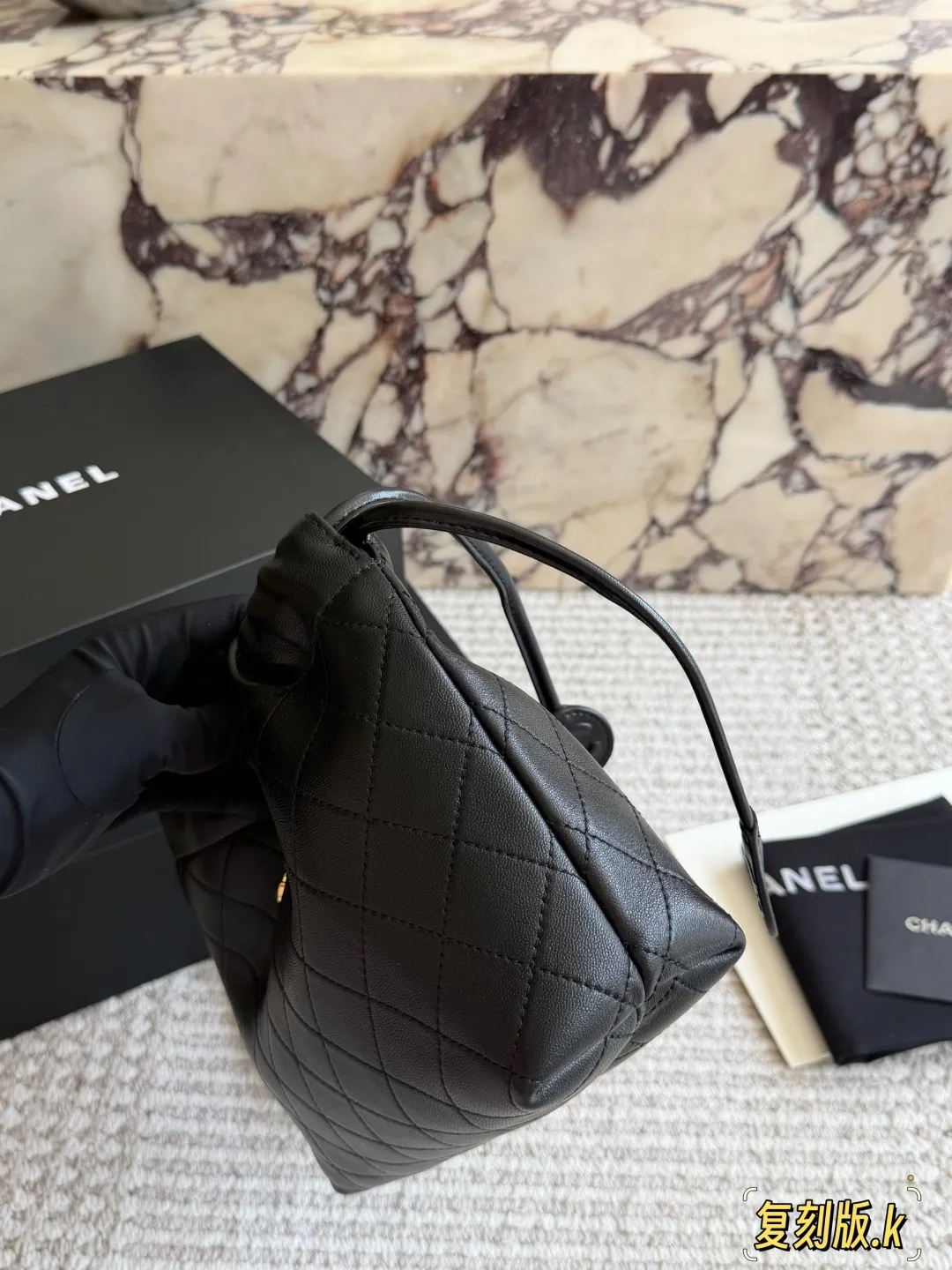Chanel 26S Quilted Lambskin Drawstring Bucket Bag D34018085 — view 3