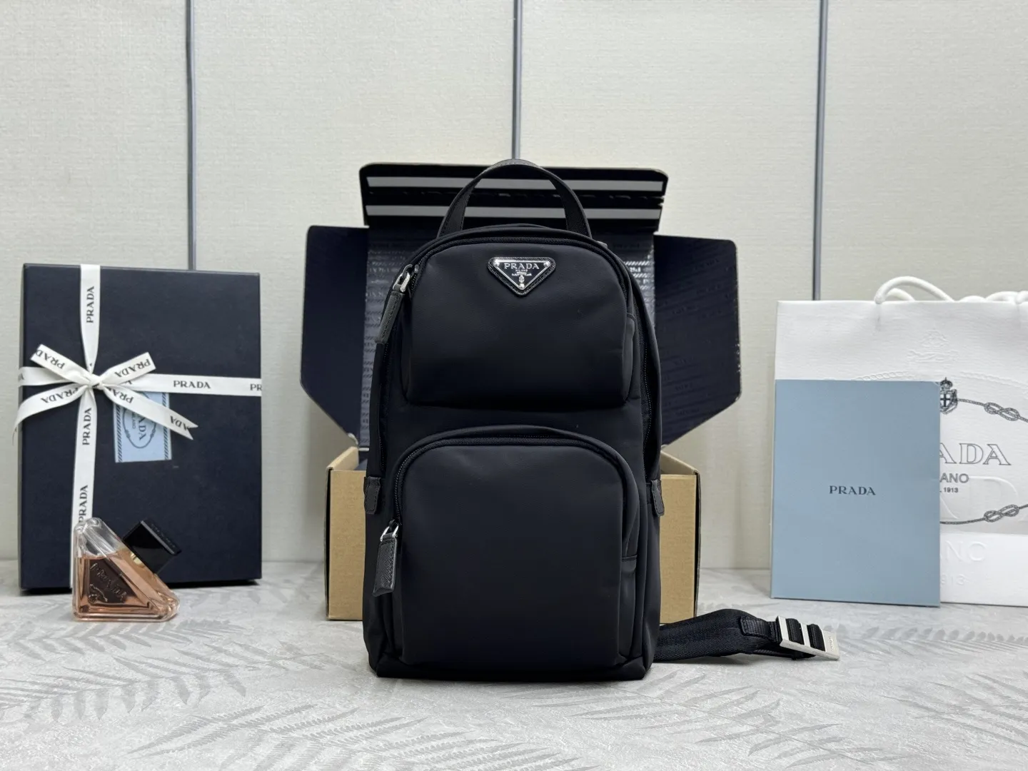 Re-Nylon and Saffiano Leather Sling Backpack D68016313