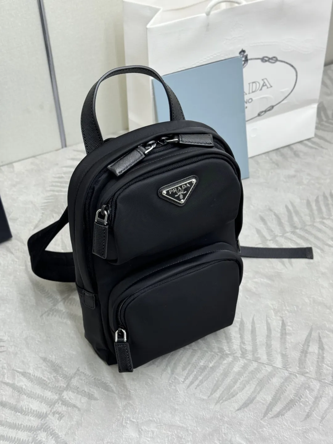 Re-Nylon and Saffiano Leather Sling Backpack D68016313 — view 3