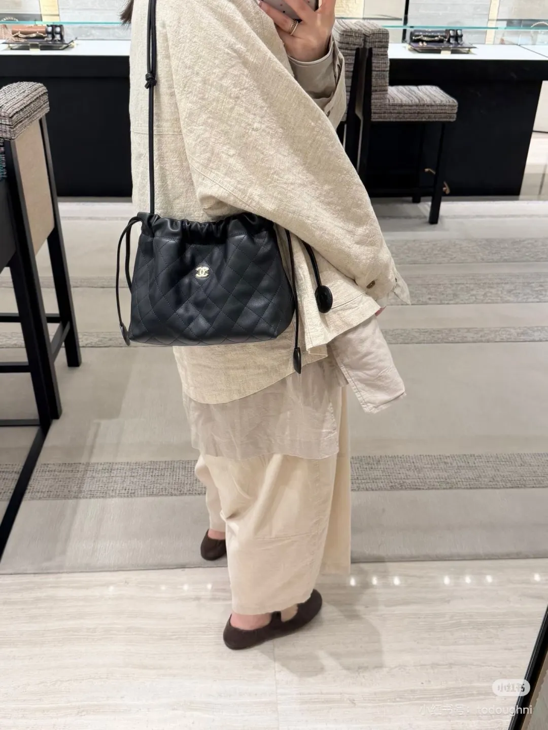 Chanel Quilted Leather Drawstring Bucket Bag D34018087 — view 8
